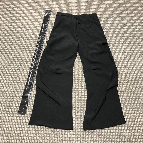 Black baggy slacks with folds. Beautiful peice, the folds make it sit right, so - Picture 6 of 6